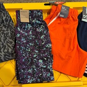 Nike Kids' Orange and Purple Patterned Shorts this is a set of 4 shorts for girl